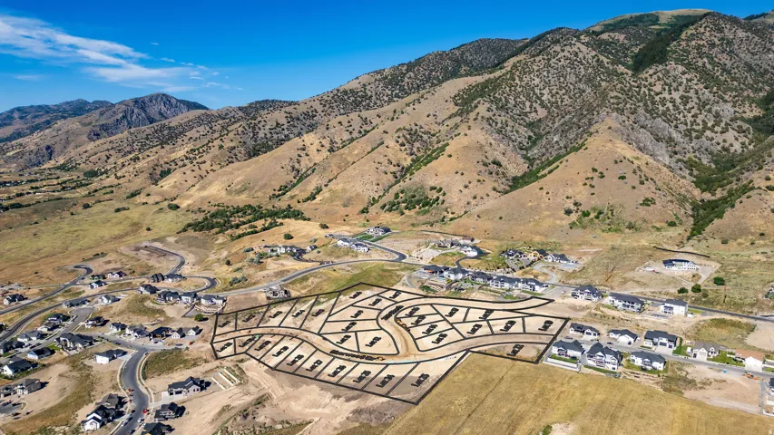 Developed residential area with mountain backdrop, featuring a planned community layout
