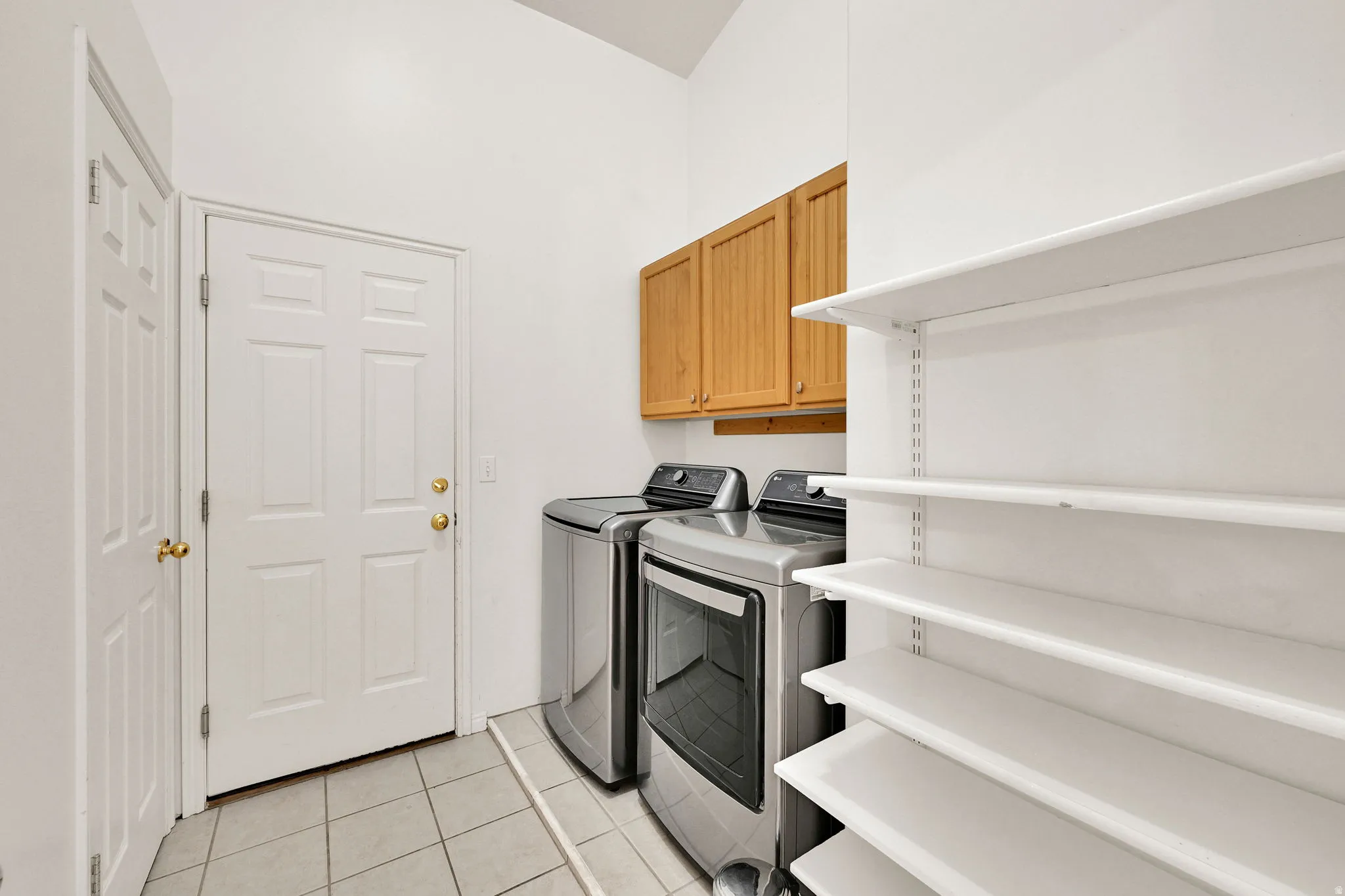 Practical utility area featuring durable tile flooring