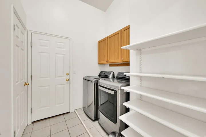 Practical utility area featuring durable tile flooring
