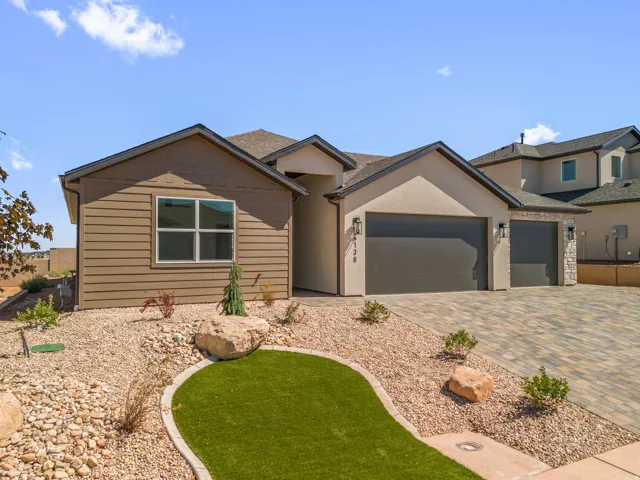 Contemporary exterior with a multi-tone stucco finish and horizontal siding