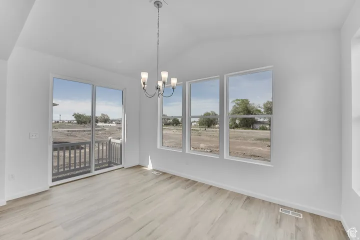Interior space featuring abundant natural light from multiple windows and a sliding glass door