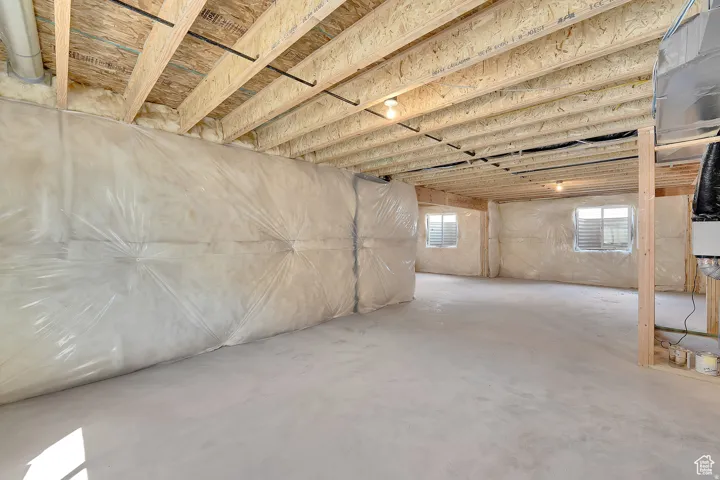 Unfinished basement offering expansive concrete flooring