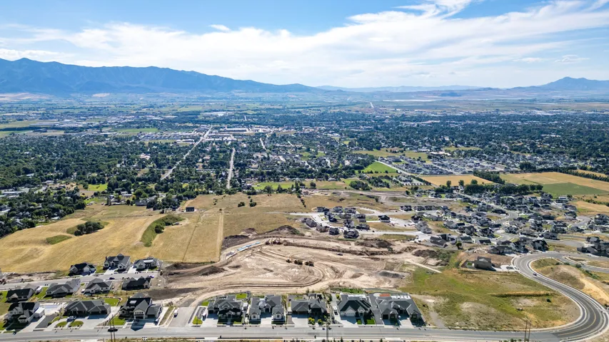 Aerial perspective showcasing residential development with mountain backdrop