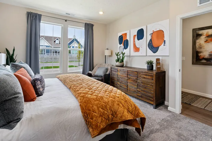 Carpeted room featuring dual double-hung windows with street-facing orientation