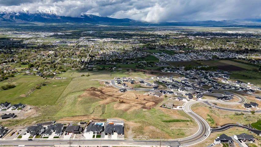 Aerial perspective showcasing a developing residential area with established homes and new construction
