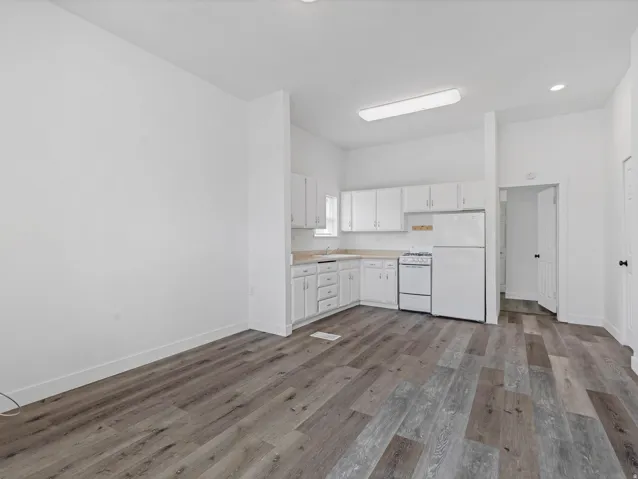 Unit 1. Open-concept living space with LVP flooring