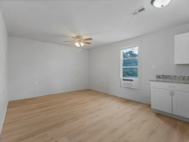 Unit 3 - New floors, cabinets, Granite countertops & stainless steel fridge.