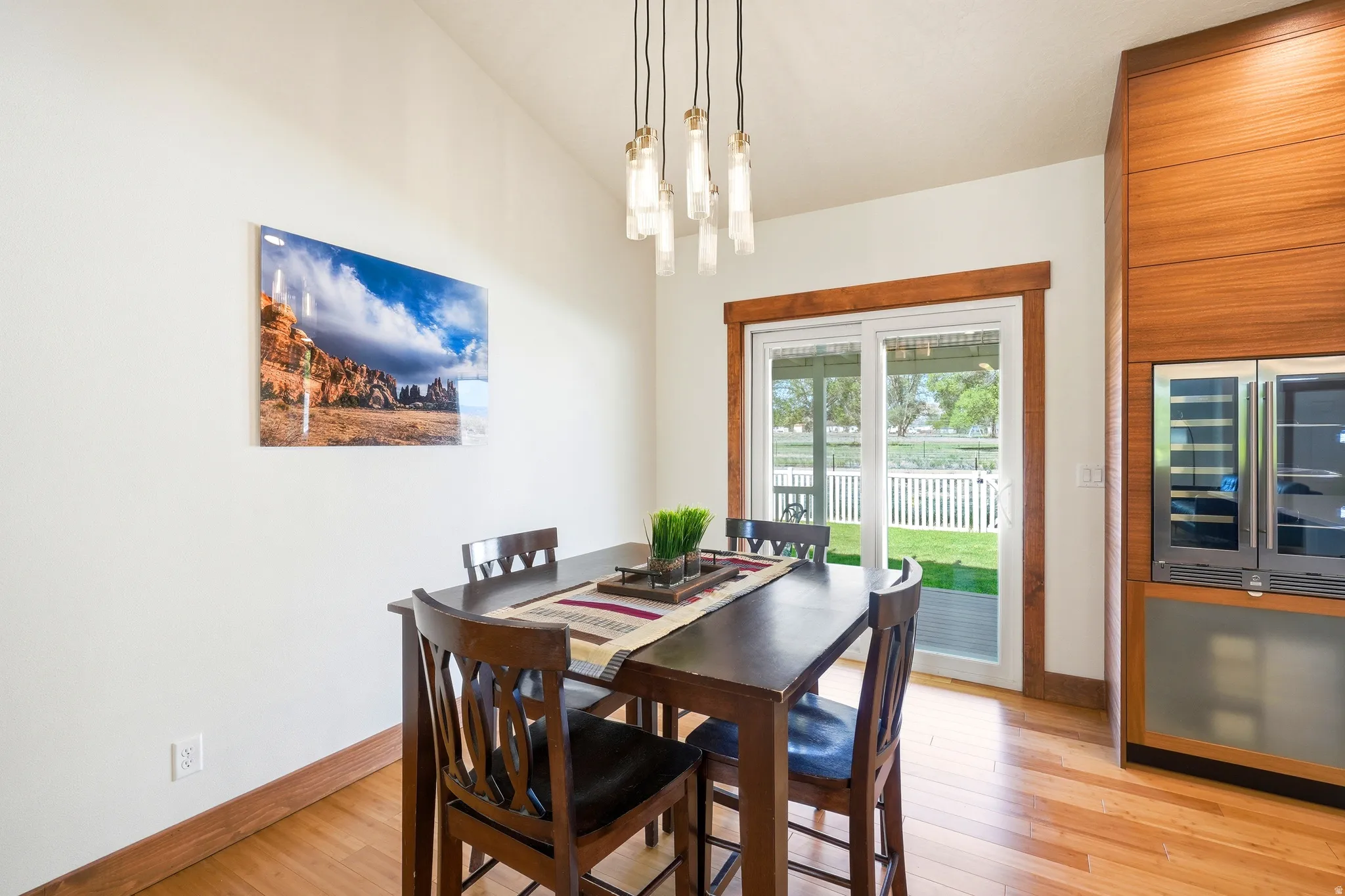 Notice the 2 zone beverage cooler with a culinary ice maker below, and new sliding glass doors with built in blinds.