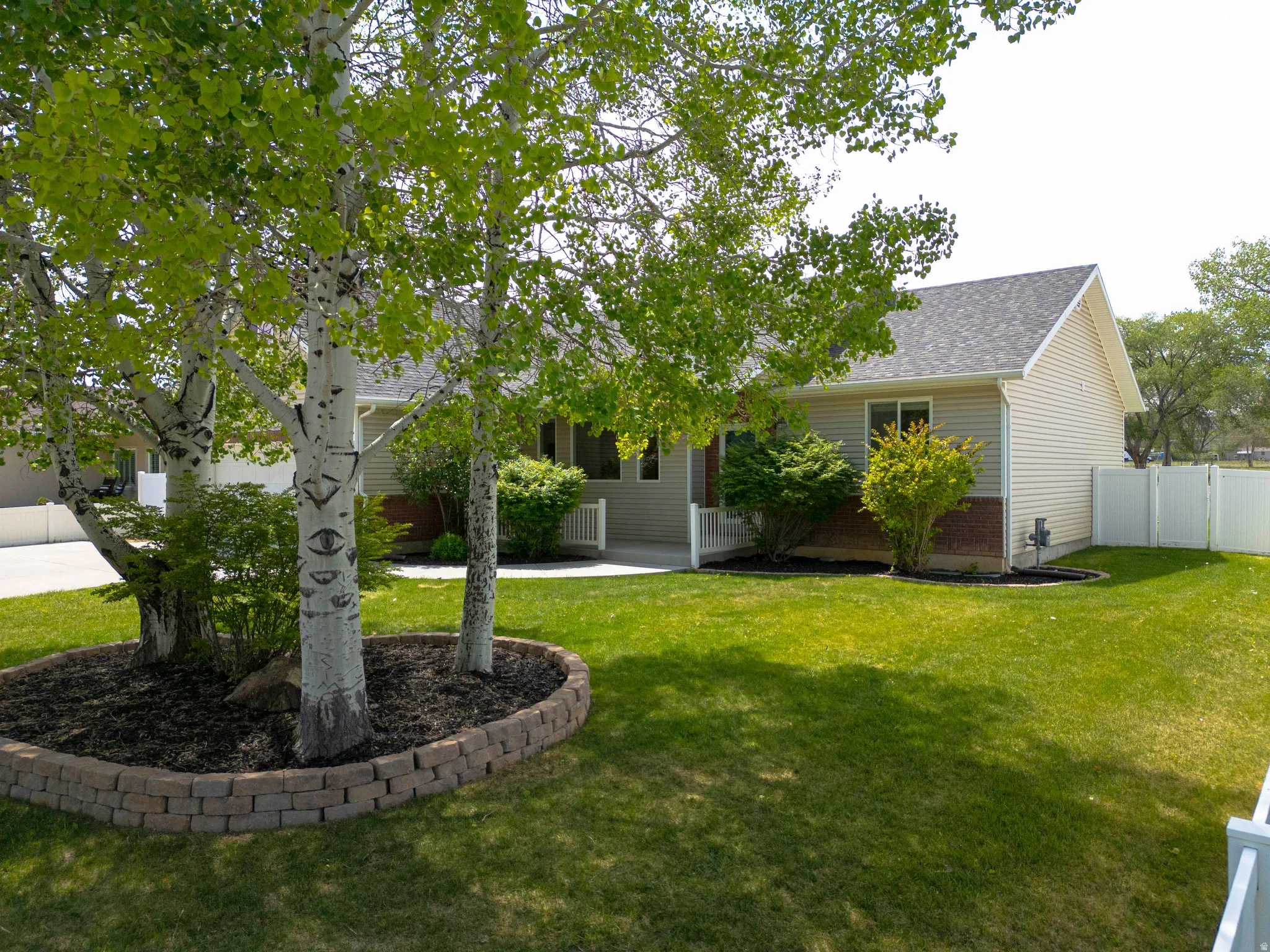 Mature trees, established landscaping, lush lawn, and a full automatic sprinkler system