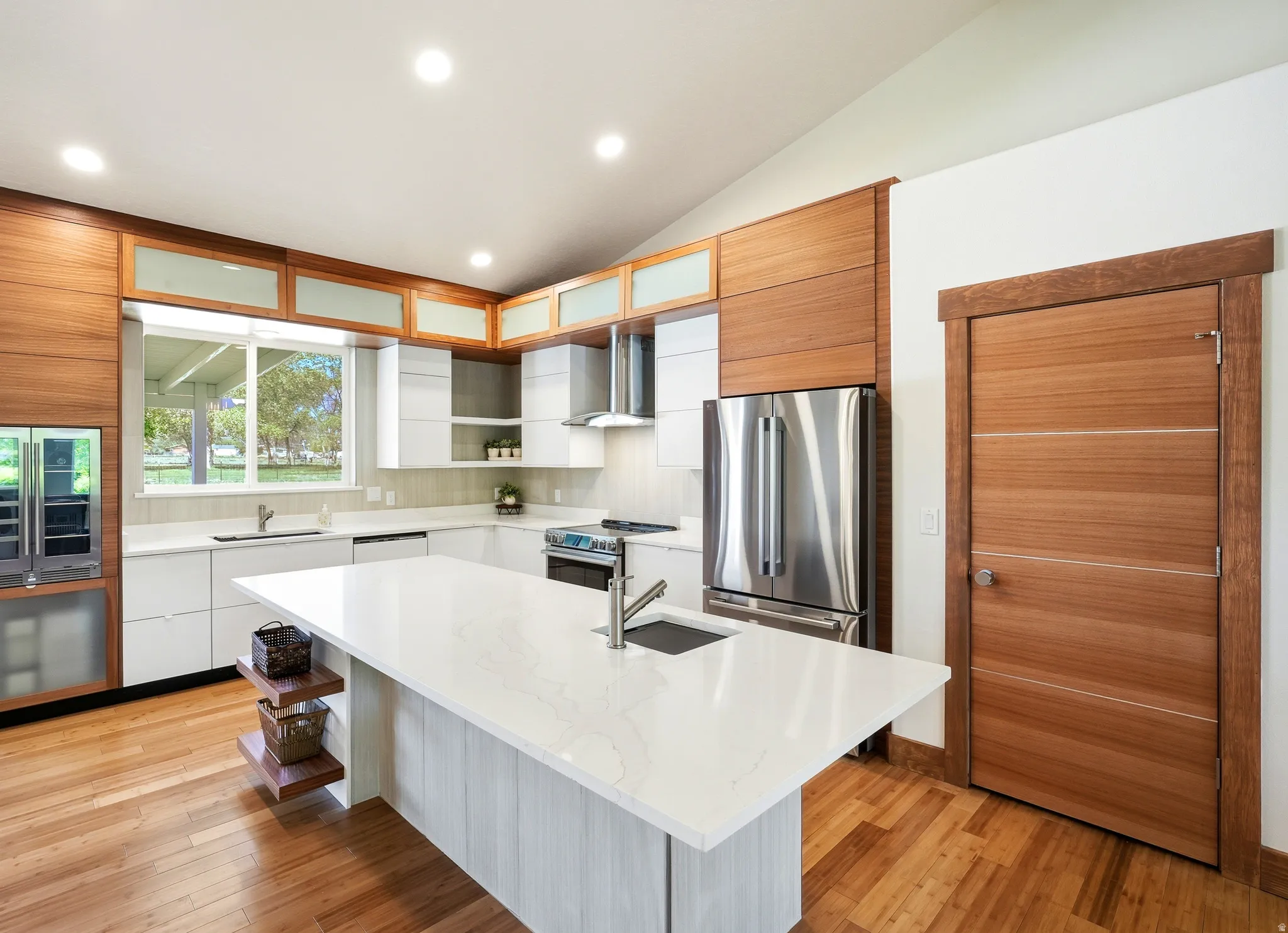 State of the art smart appliances, 32" undermount double bowl sink and work station with full accessories.  Also shown, a large pantry