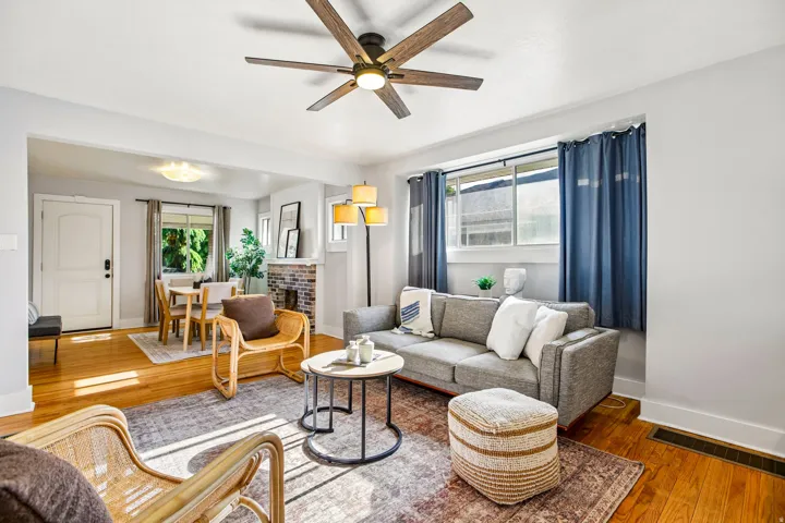Open concept living area featuring wood-finish flooring