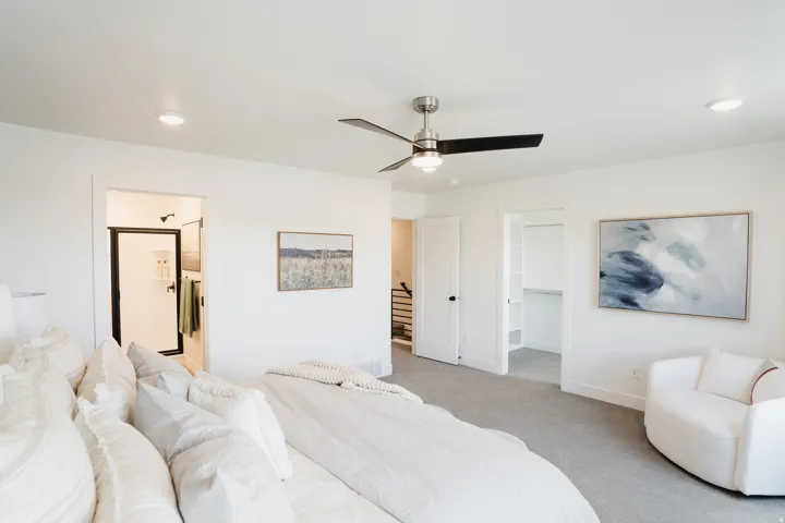 Spacious room with light-toned carpeting and recessed lighting