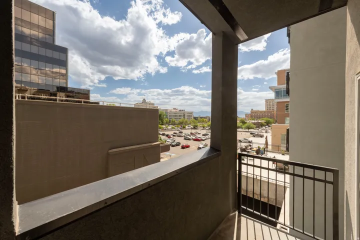 Balcony with metal railing and urban surroundings