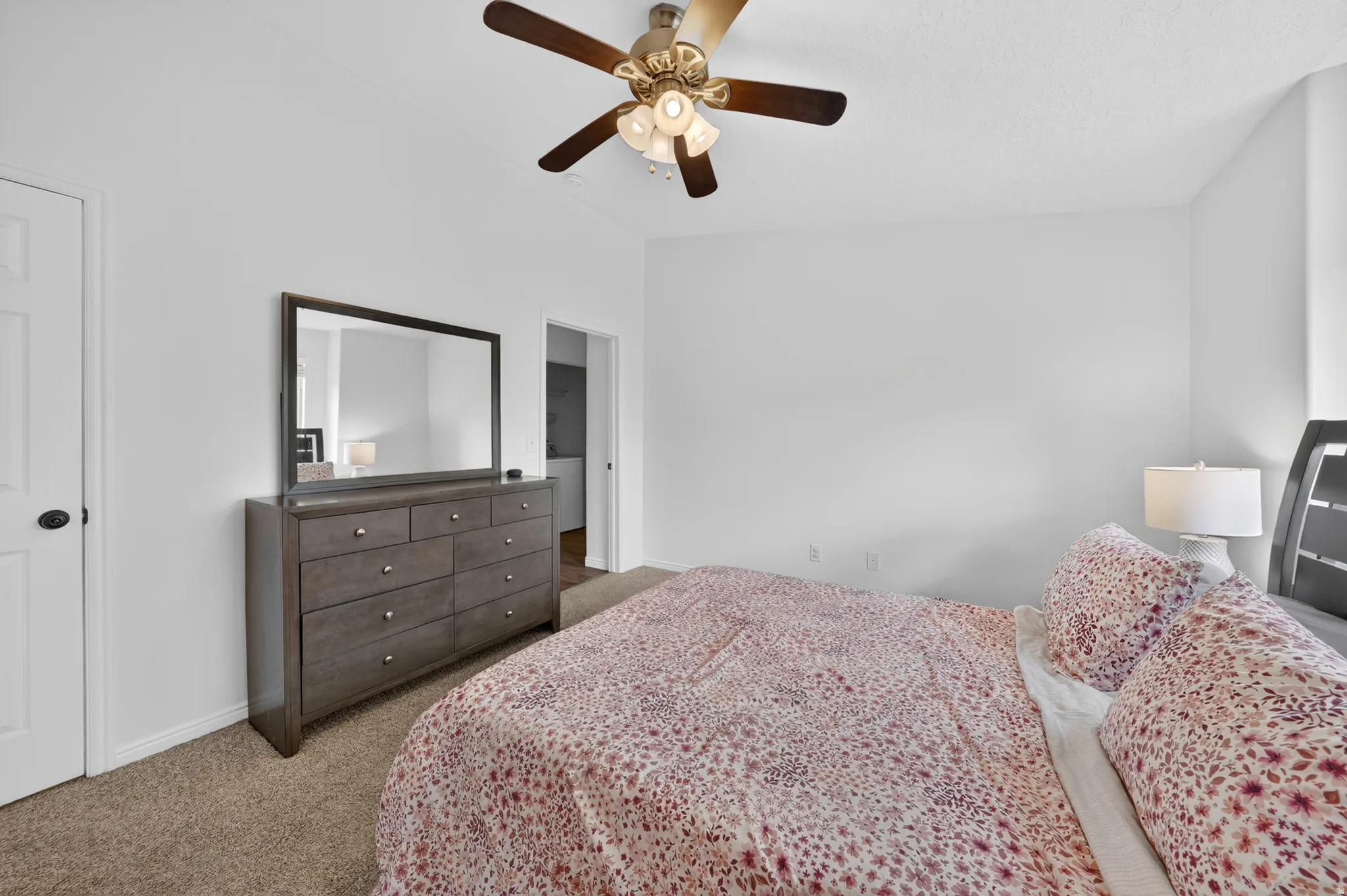 White walls with a ceiling fan overhead