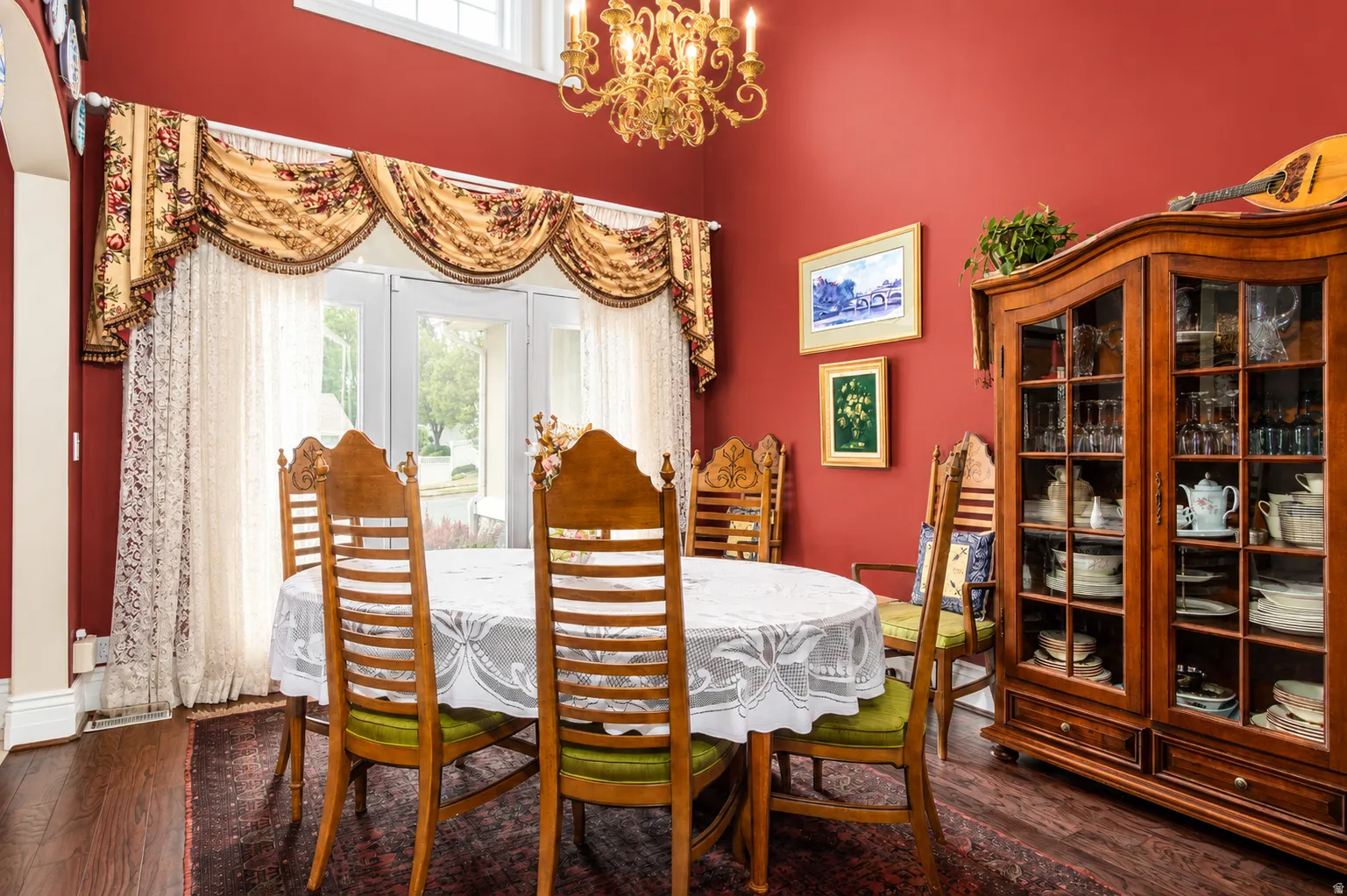 Dining area featuring a vaulted ceiling and an ornate chandelier