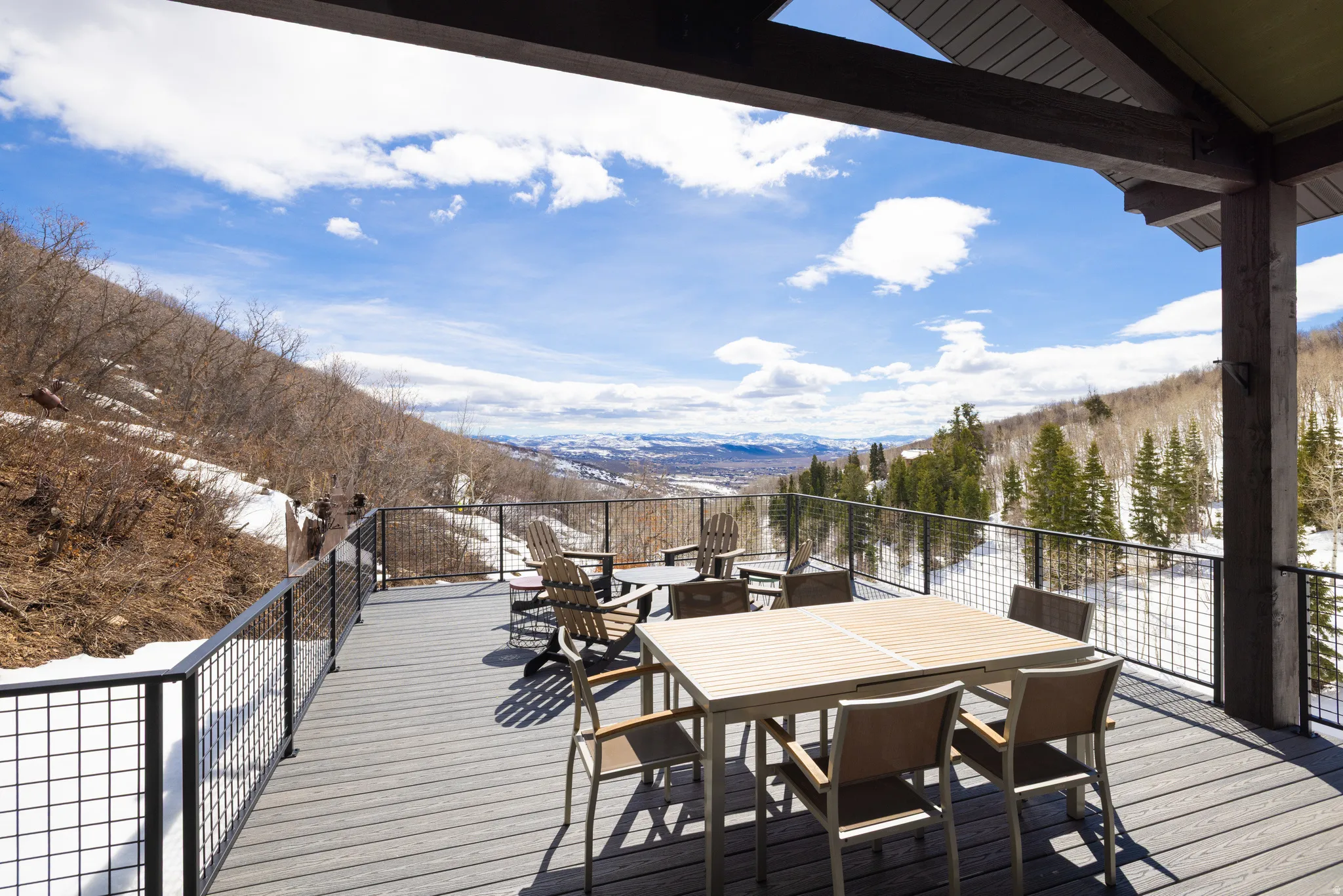 Deck featuring a mountain view and outdoor dining space