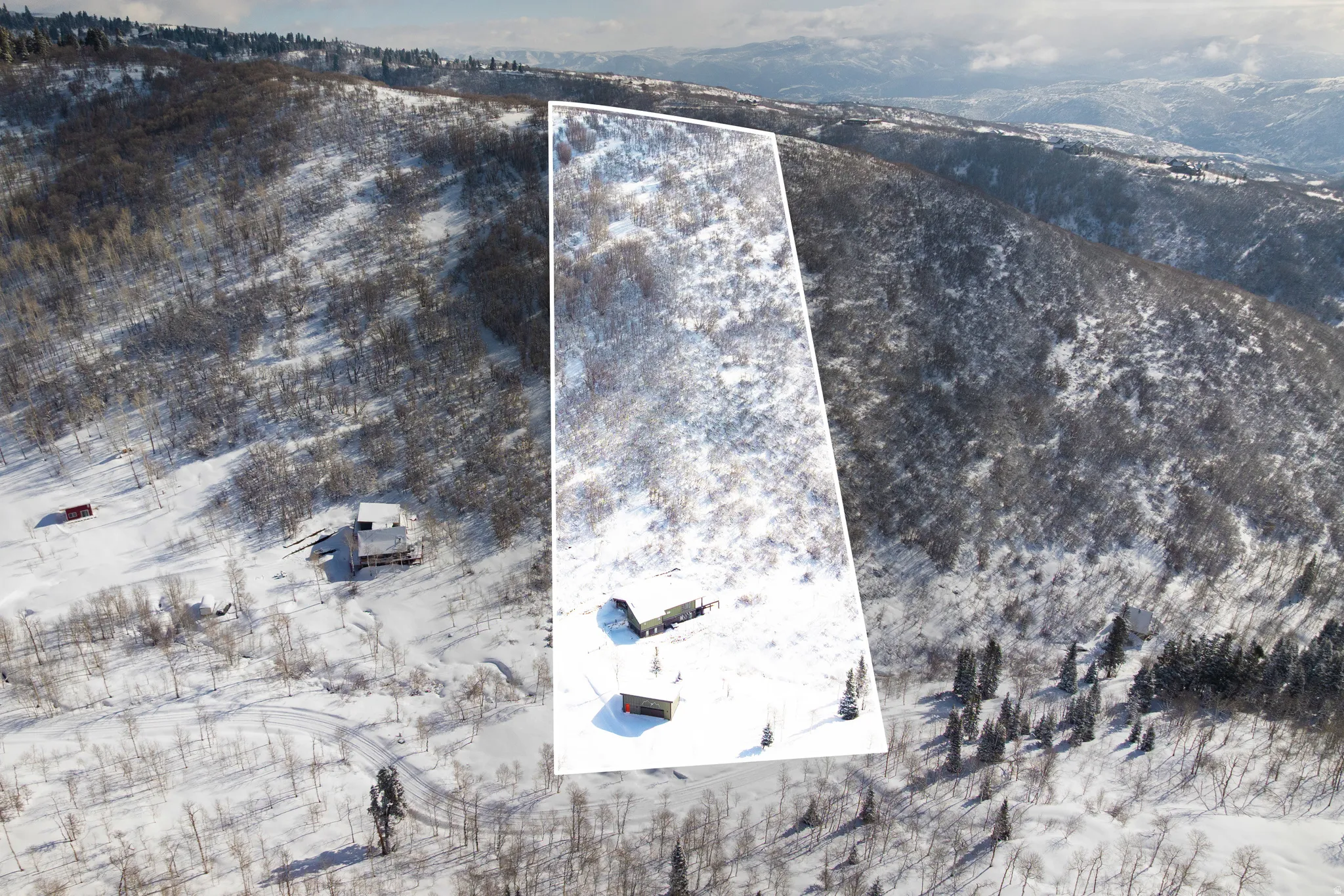 Aerial overview of property's location with property parcel outlined and a mountain backdrop