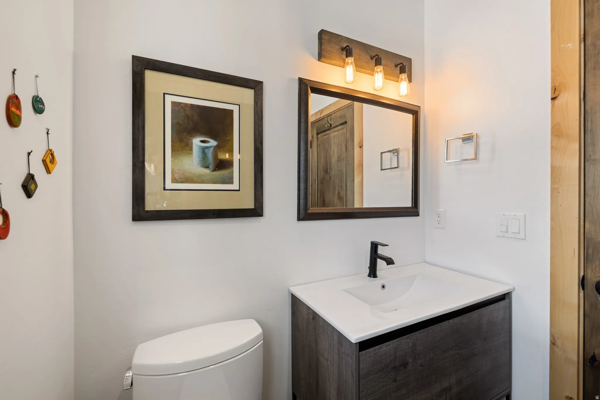 Bathroom featuring toilet and vanity