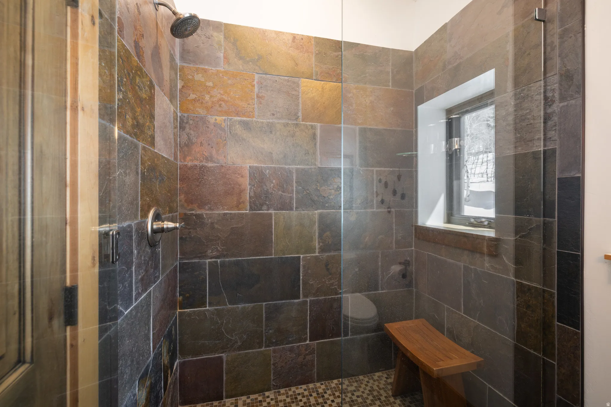 Bathroom featuring a shower stall