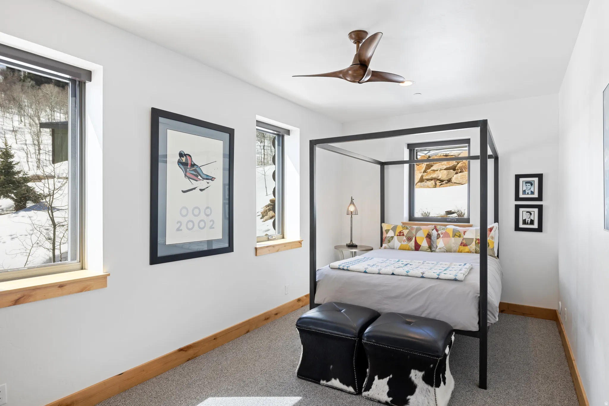 Bedroom featuring light carpet and a ceiling fan