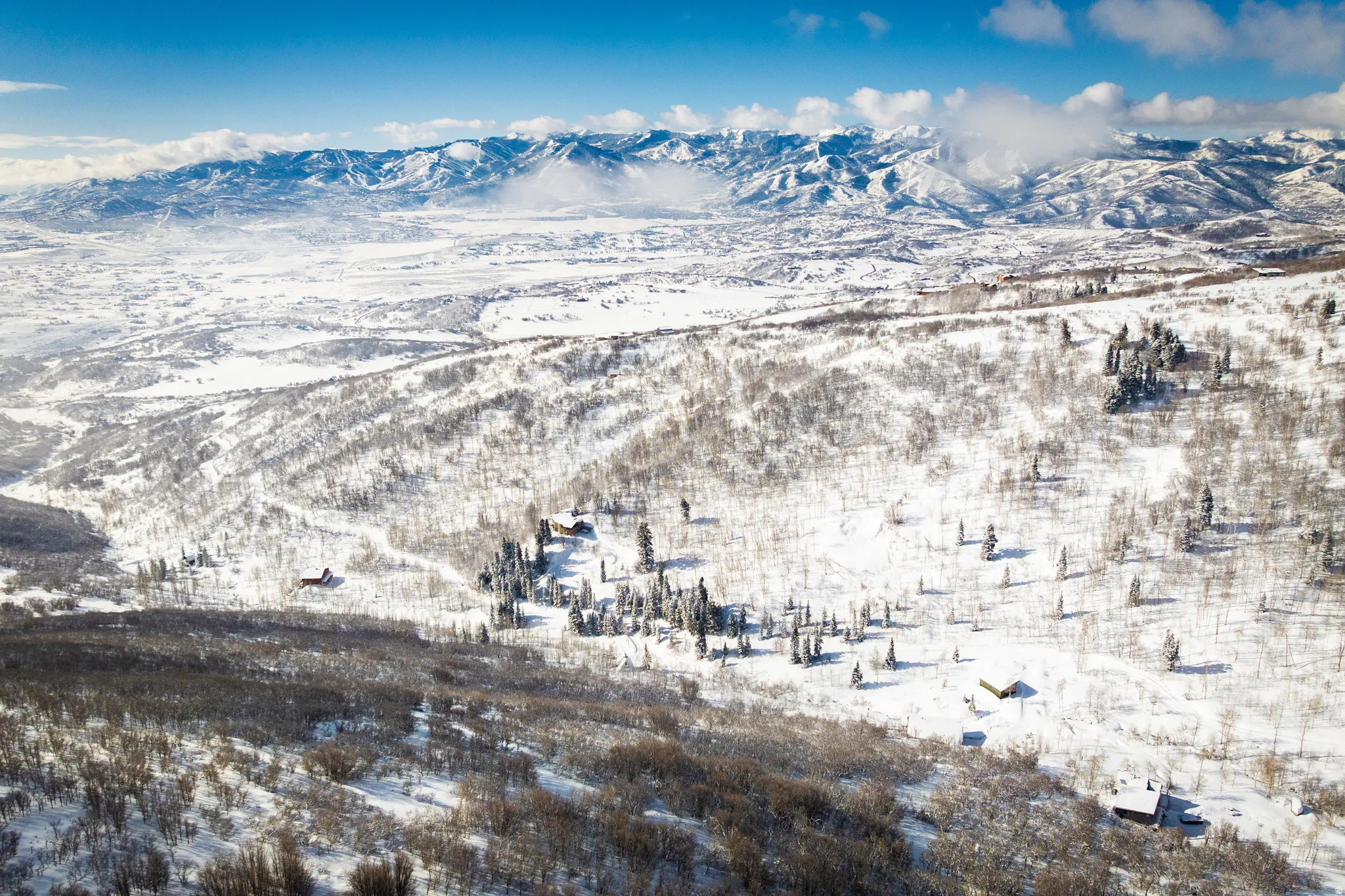 Snowy aerial view with a mountain view