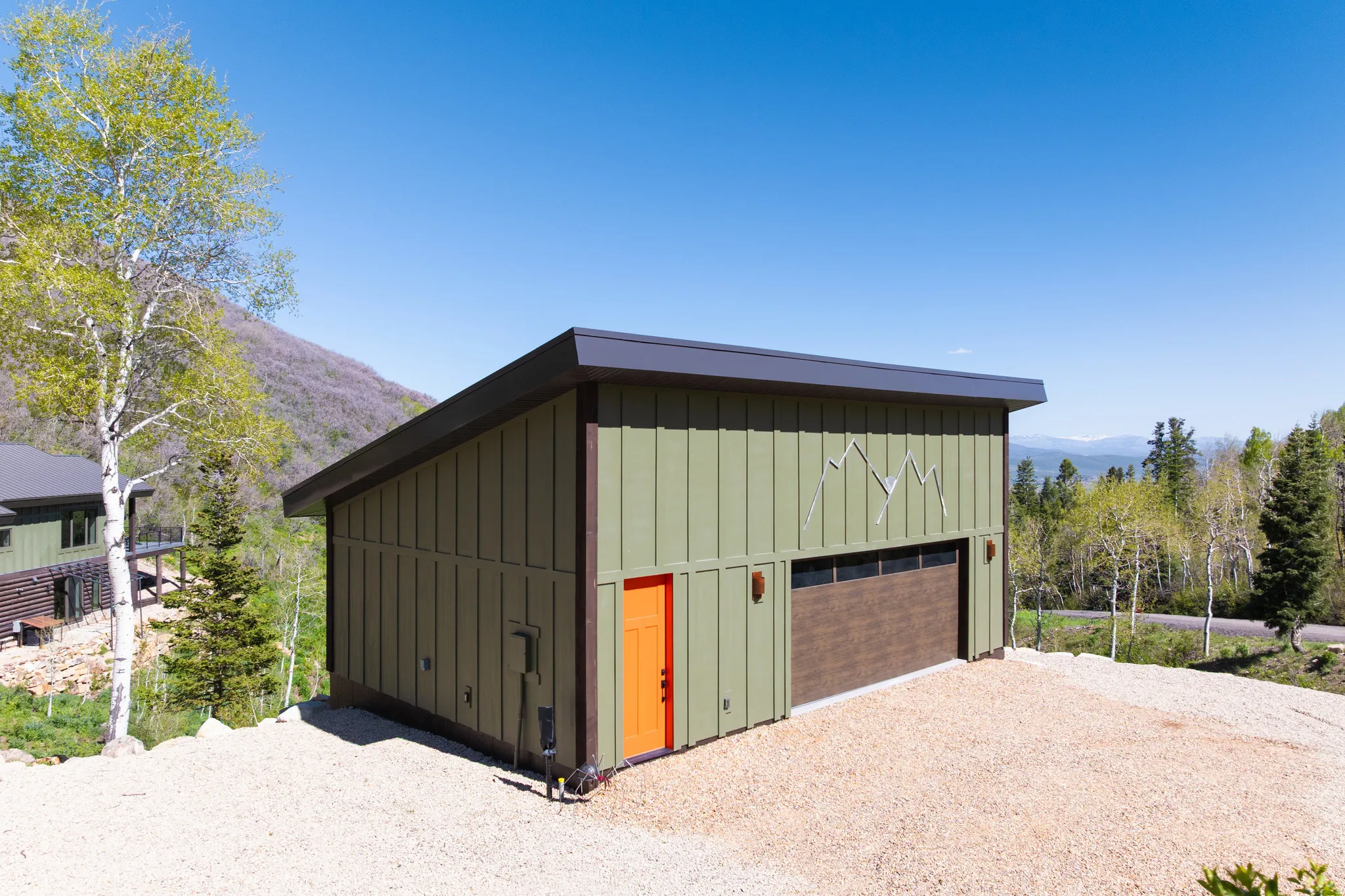 Garage featuring a detached garage and a mountain view