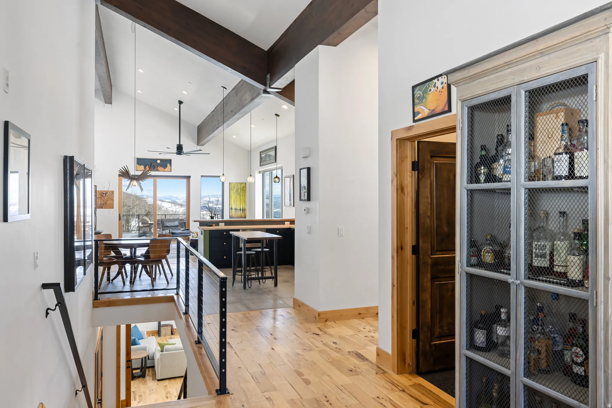 Hallway featuring light wood-style floors and baseboards