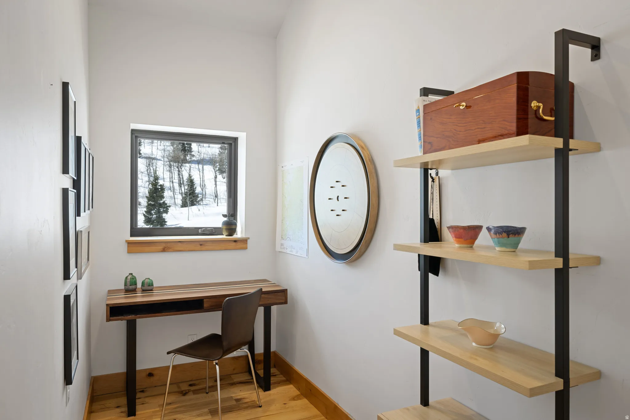 Office with light wood finished floors and baseboards