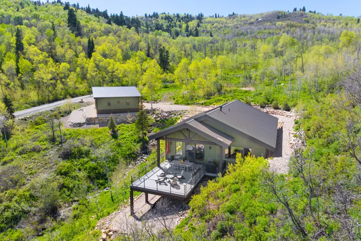 View from above of property with a heavily wooded area