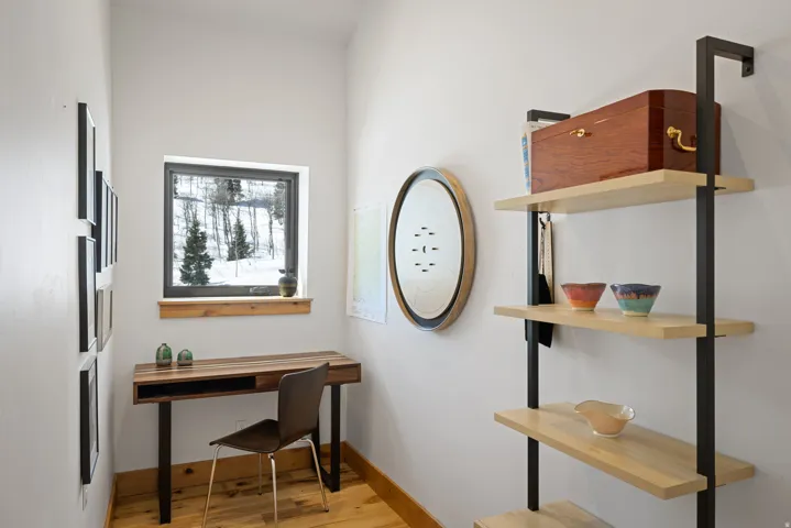 Office with light wood finished floors and baseboards