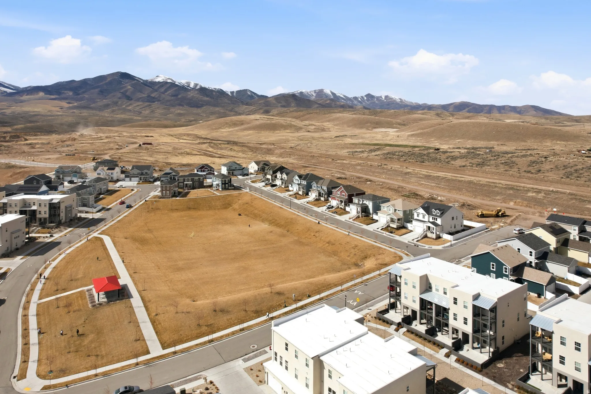 Aerial view of residential area featuring a mountain backdrop