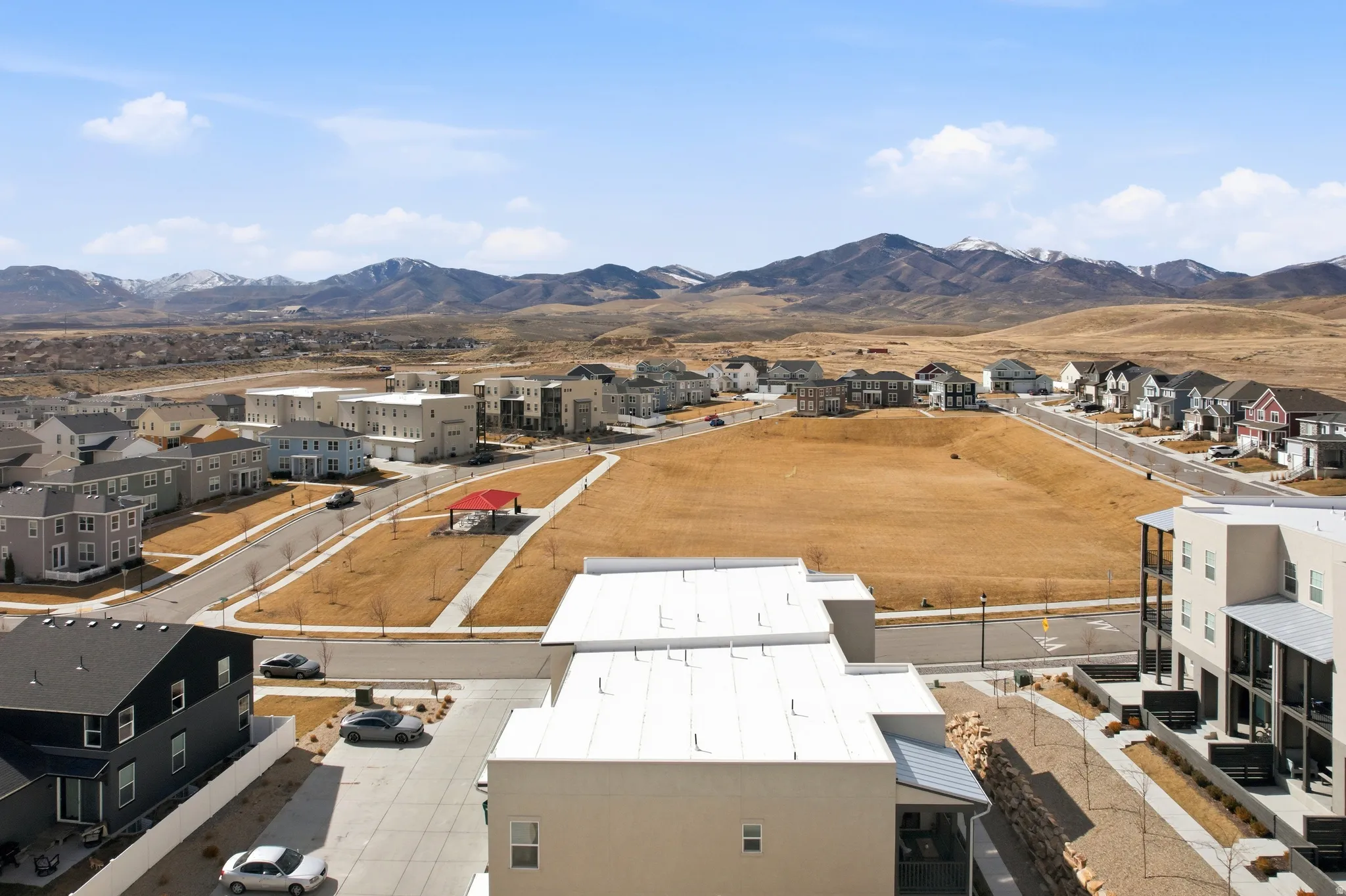 Aerial view of residential area featuring a mountainous background