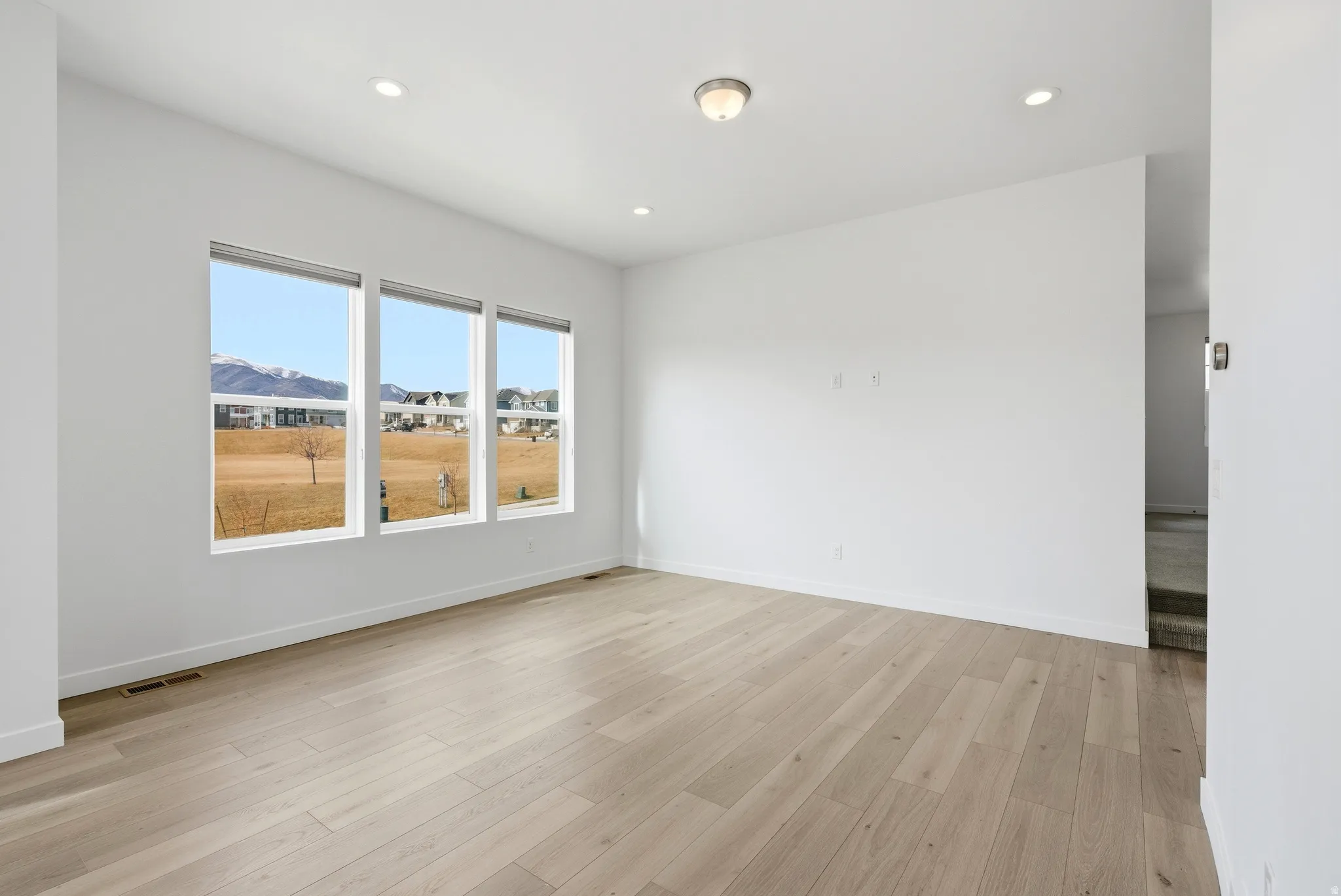 Spare room featuring recessed lighting and light wood-style floors