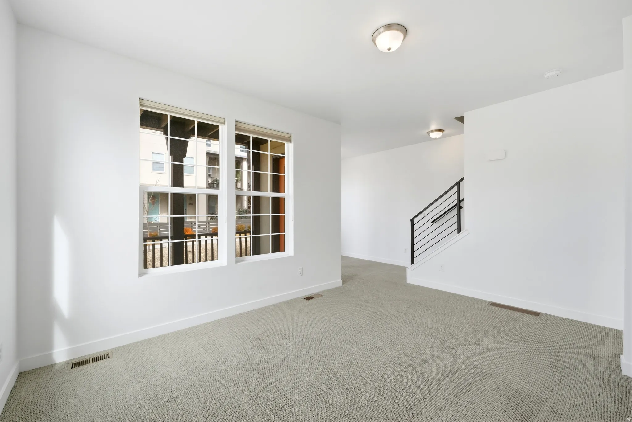 Empty room with carpet flooring