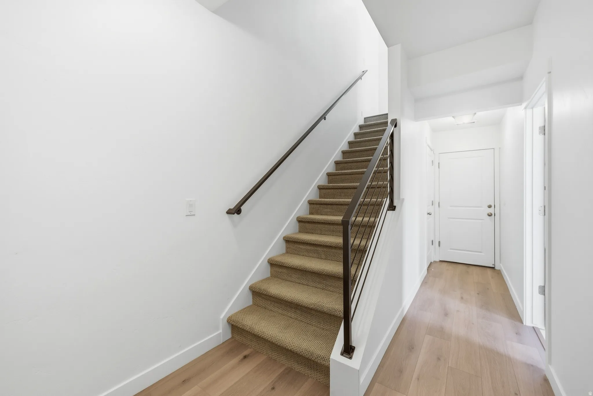Staircase with wood finished floors