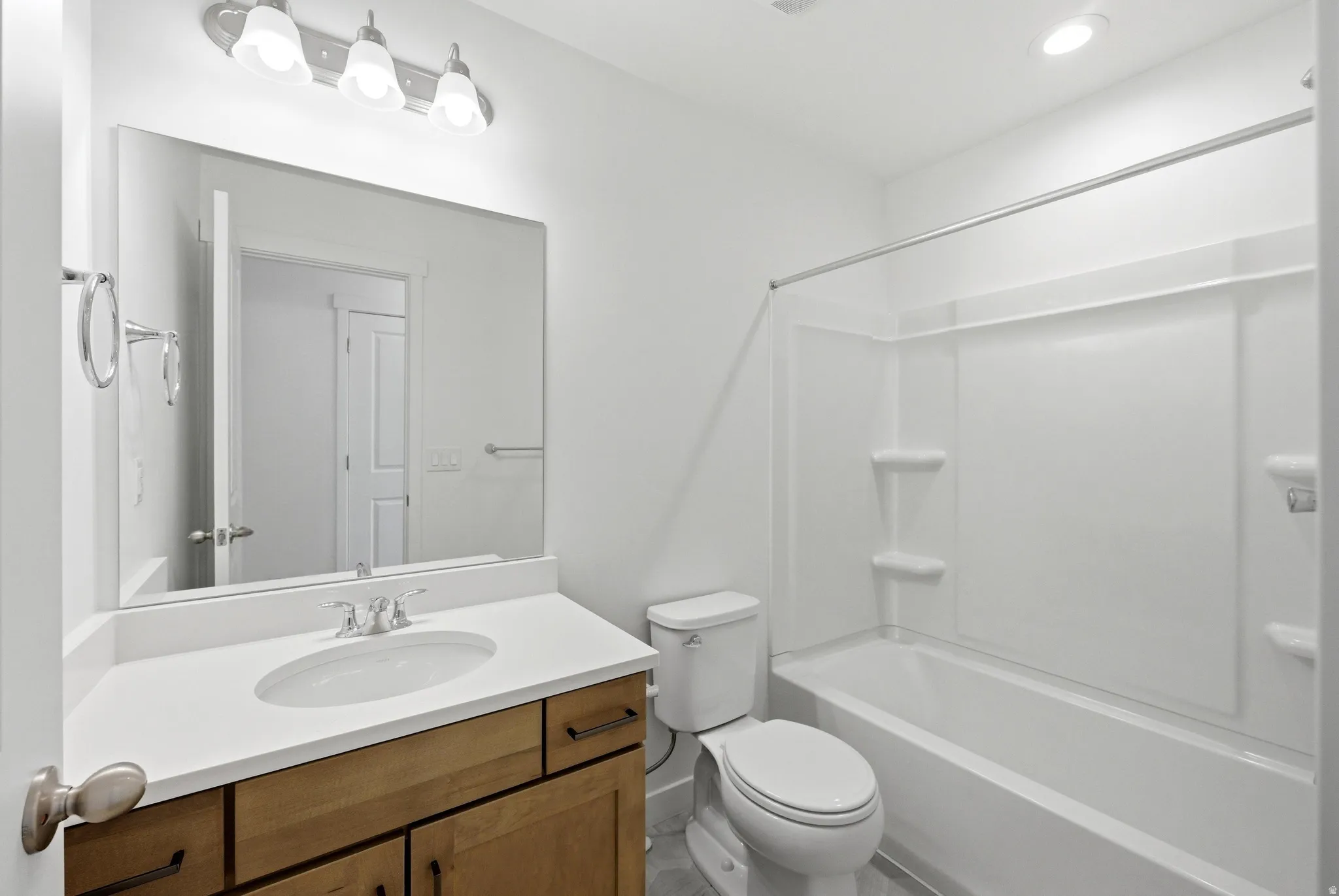 Bathroom with vanity and  shower combination