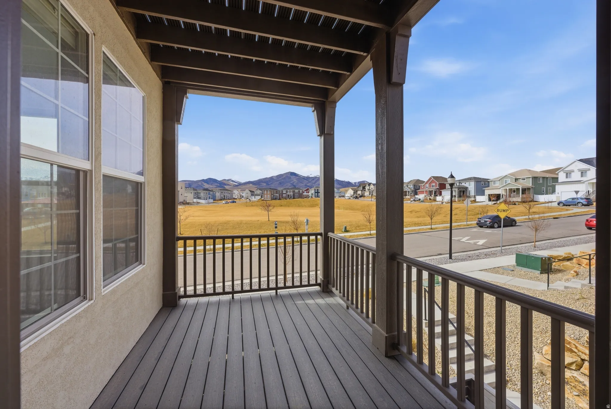 Porch featuring a residential view and a mountain view