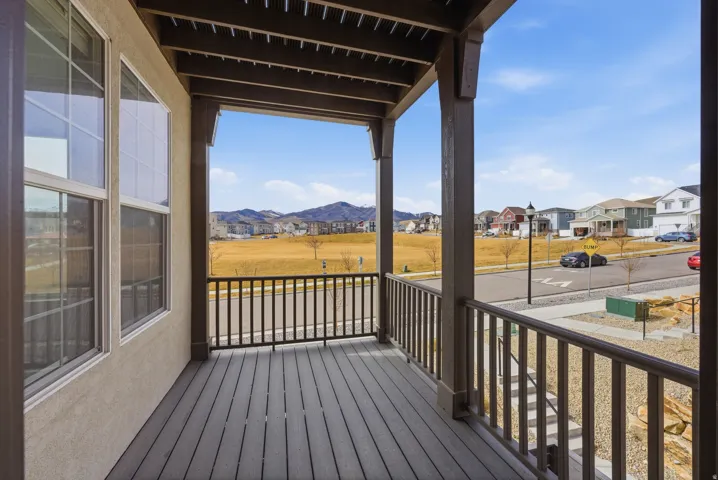 Porch featuring a residential view and a mountain view
