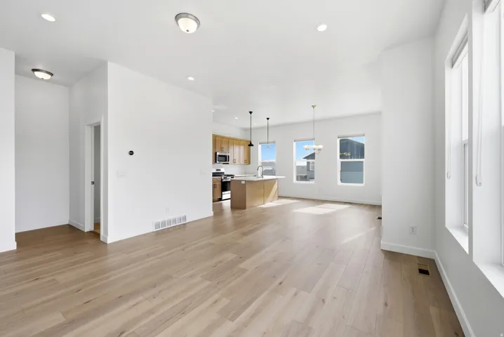 Unfurnished living room featuring recessed lighting and light wood finished floors