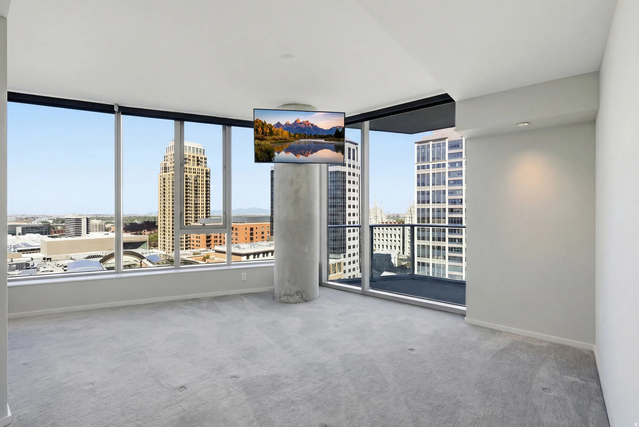 Floor-to-ceiling windows with roller shades