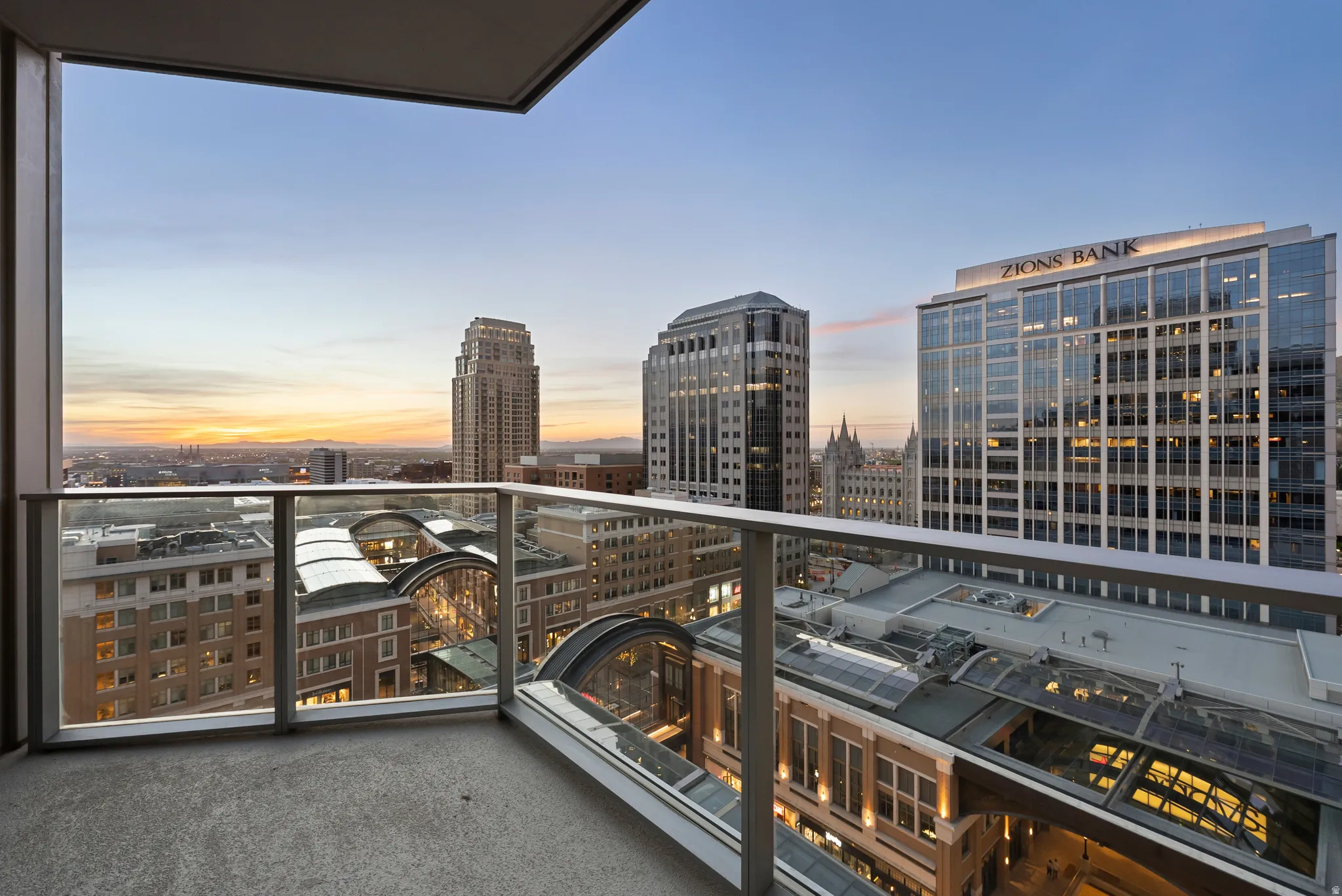 Balcony with concrete flooring and glass railings