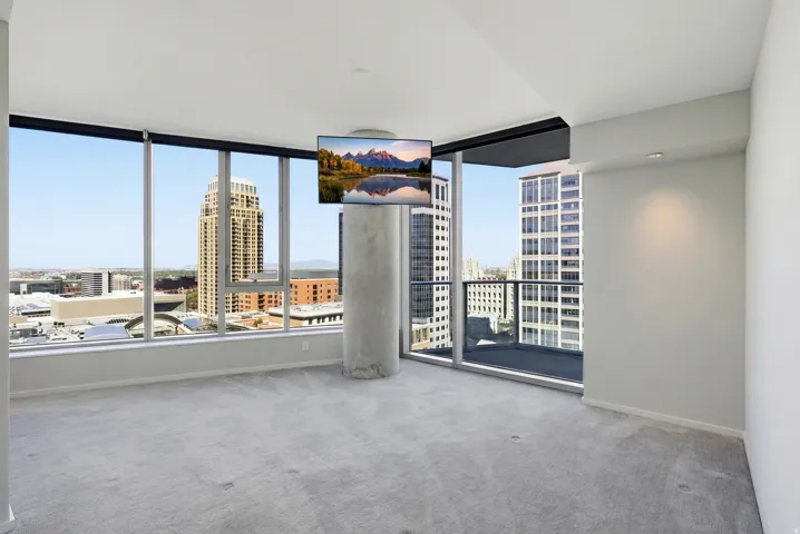 Floor-to-ceiling windows with roller shades