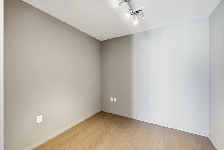 Neutral-toned room with wood-finish flooring