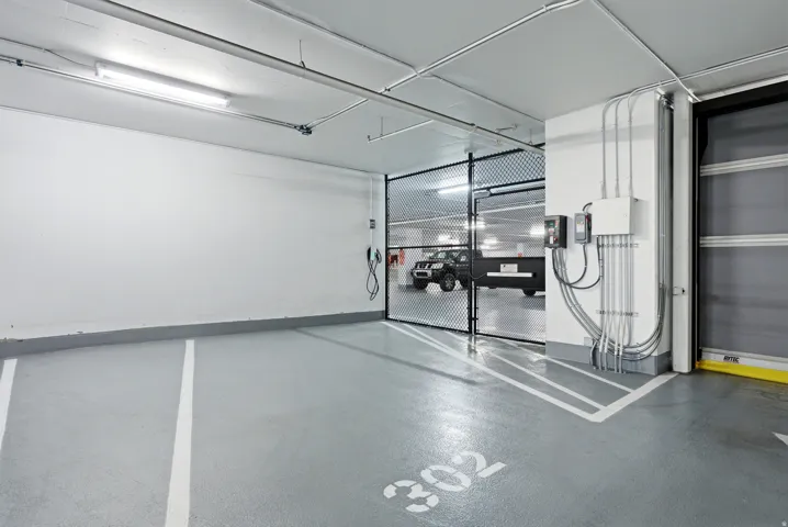 Private parking space 302 with a secured gate and EV charging station