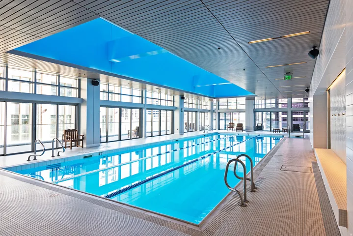 Indoor lap pool with integrated lane lines and stainless steel handrails