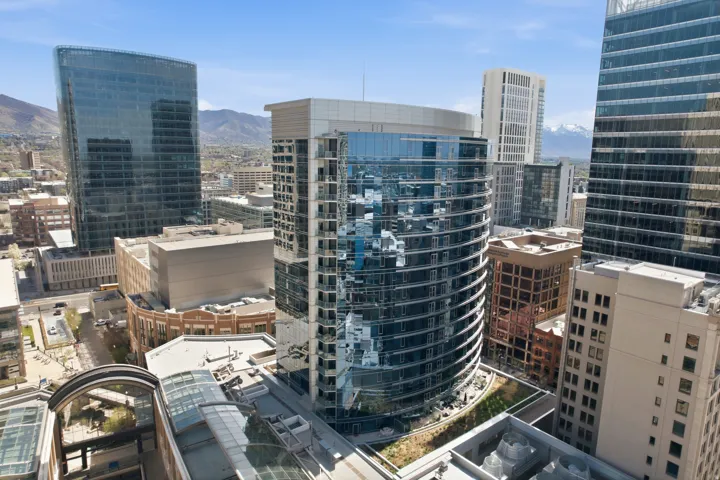 Modern high-rise with a curved glass facade and multiple floors