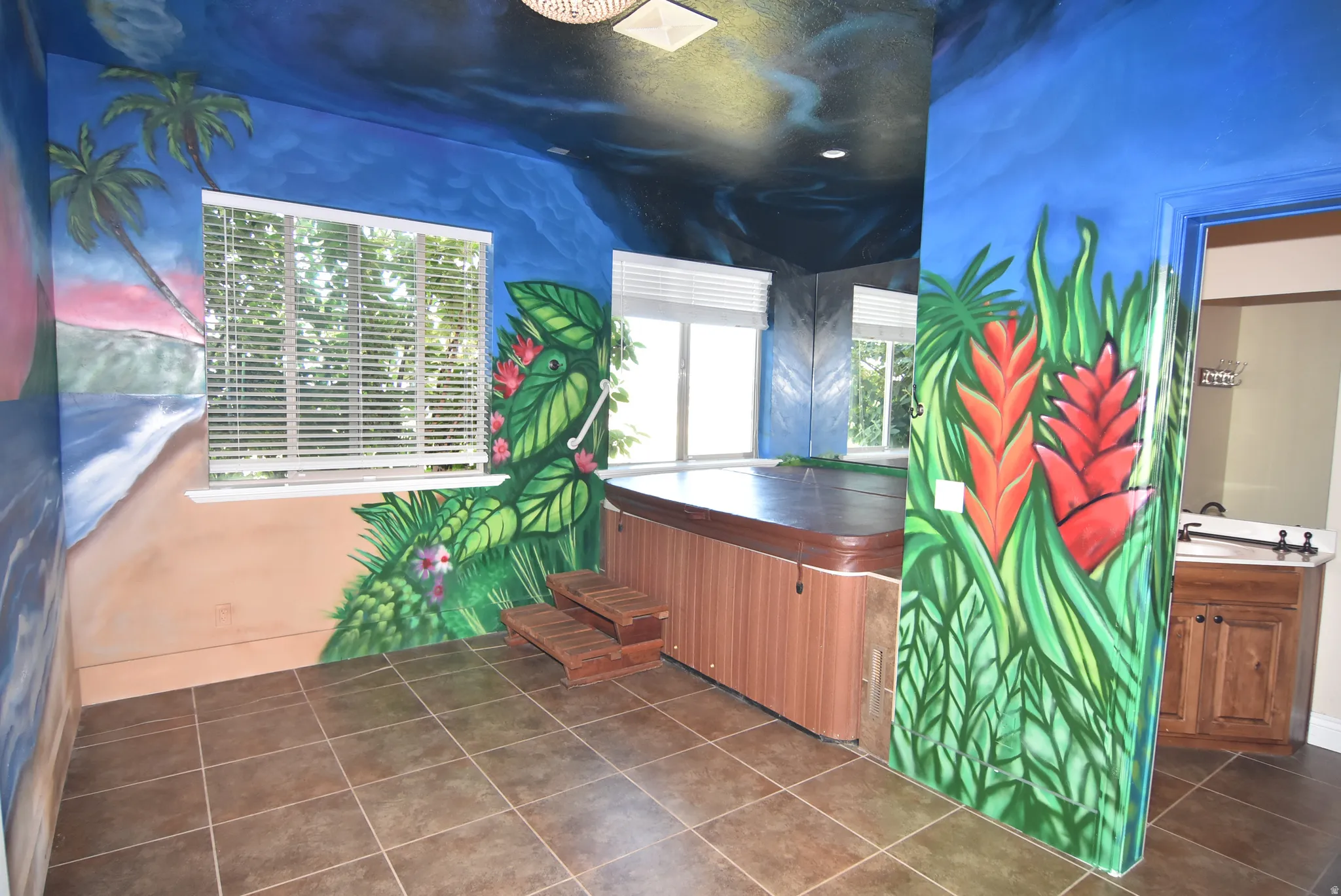 Indoor spa room featuring a wood-finish hot tub with wooden steps, with 1/2 bath.  Could be used as additional bedroom