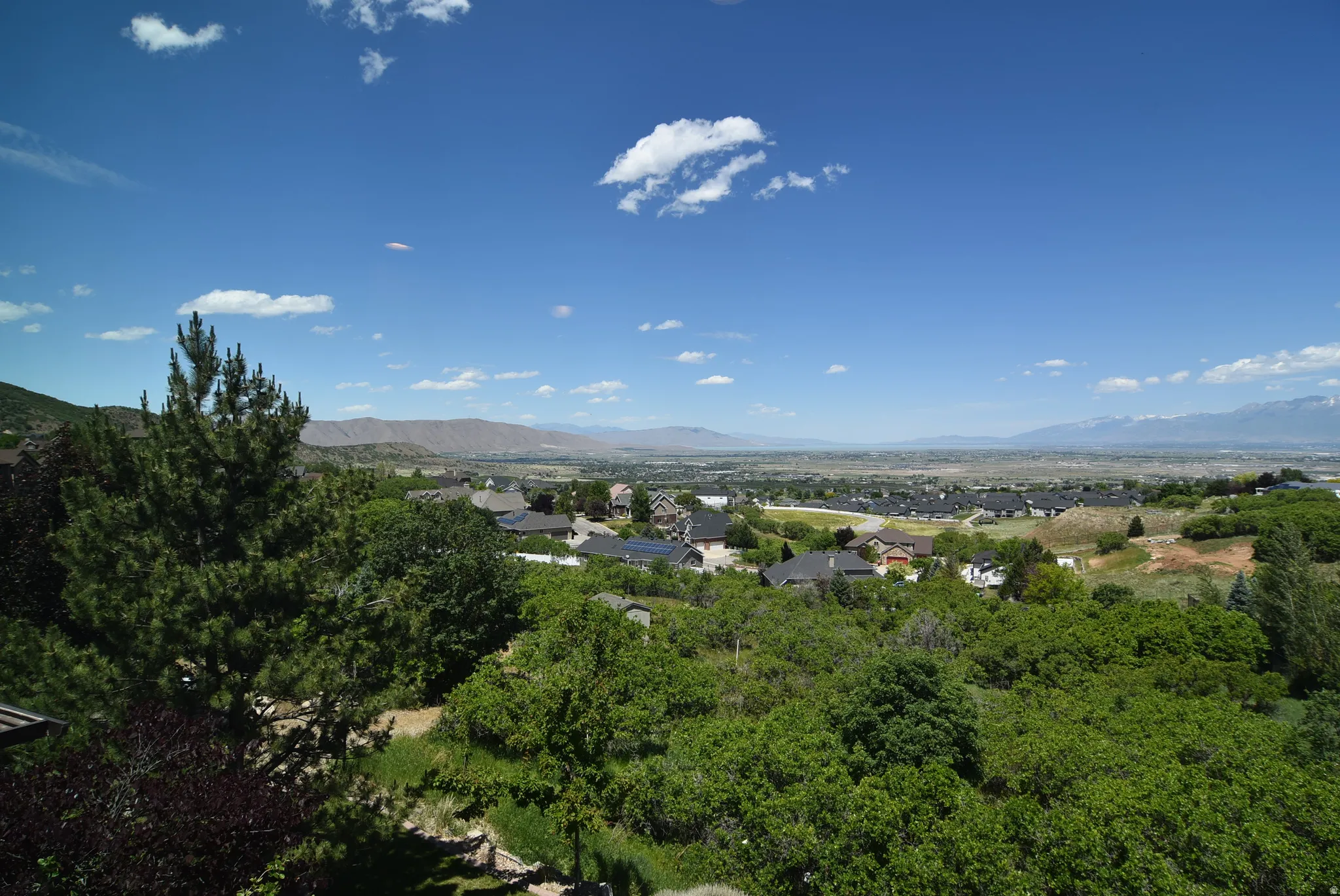 Expansive territorial panorama featuring distant mountains and a broad valley