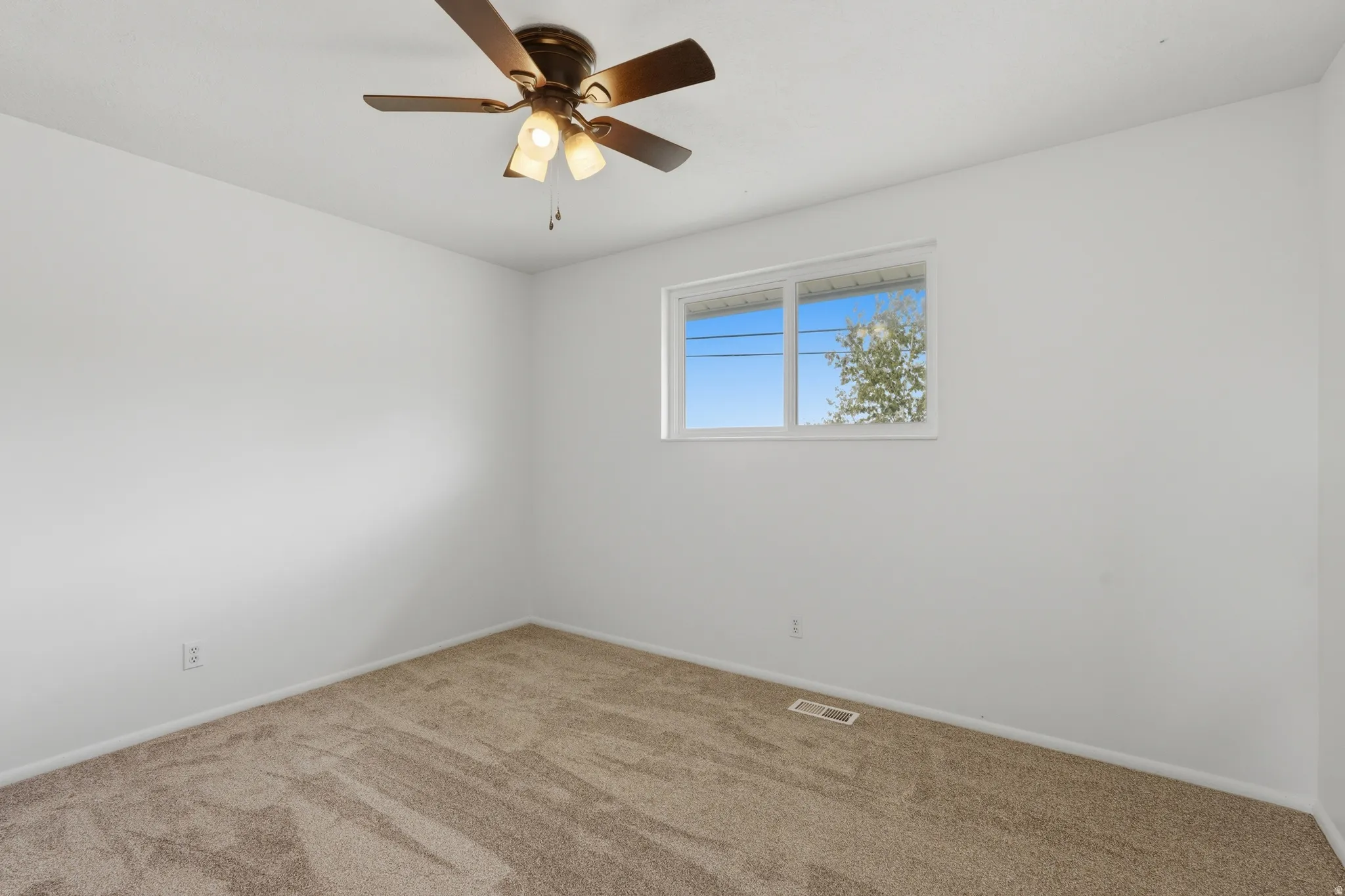Neutral tone wall finish with a double-pane window