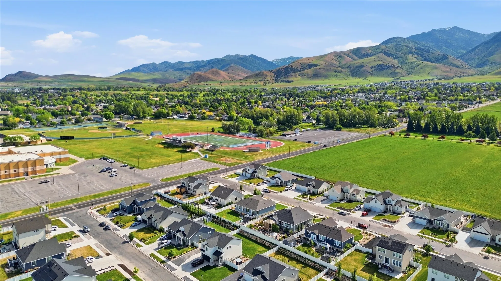Residential neighborhood featuring a grid of paved streets and modern homes with diverse architectural styles